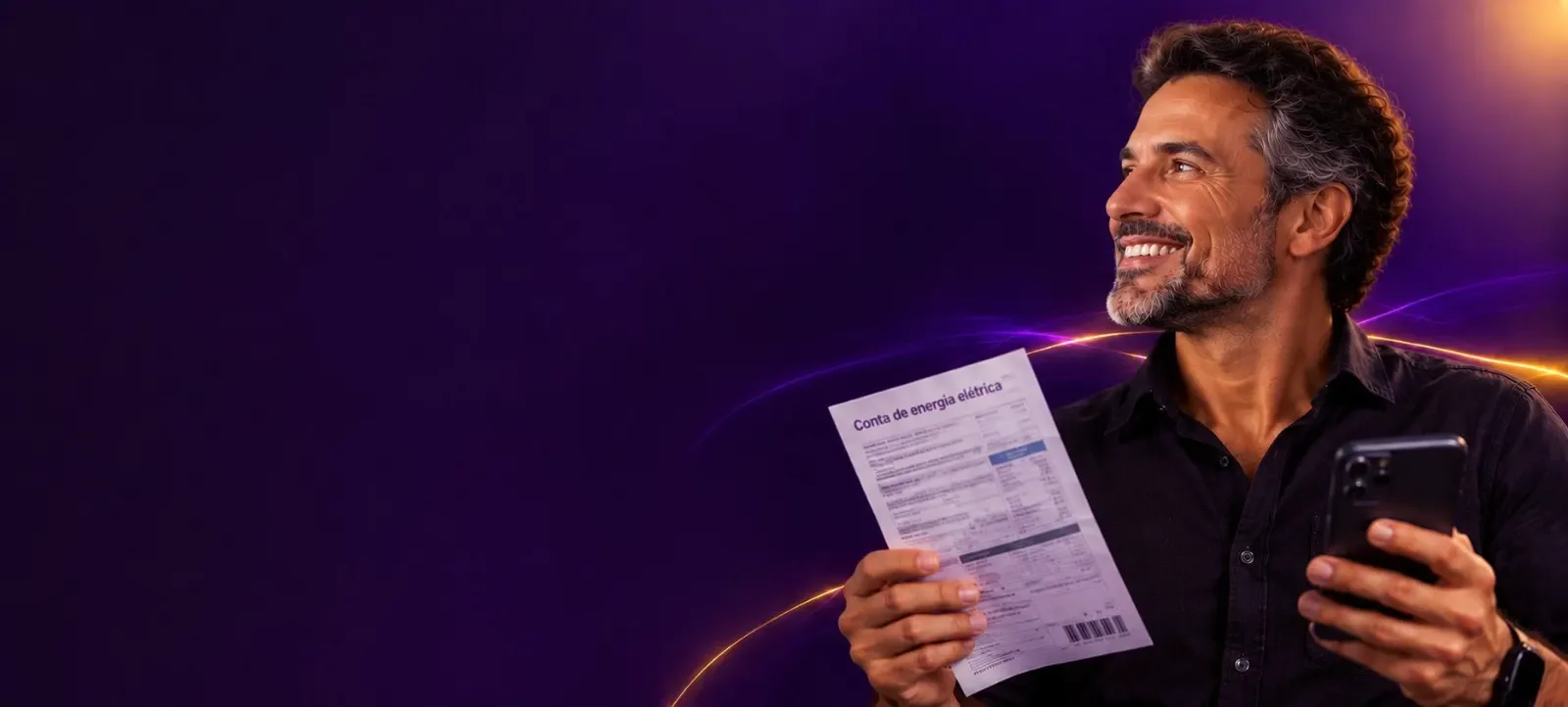 Man smiling holding his electricity bill and phone